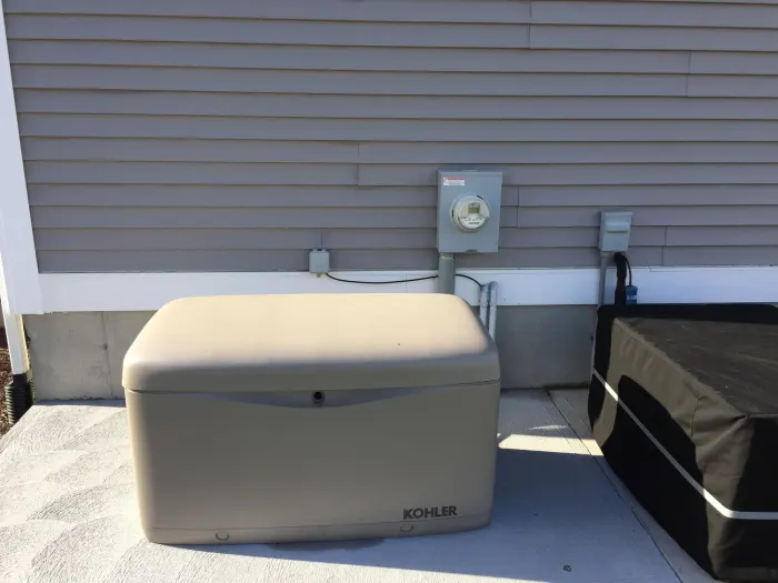 Standby generator installed beside a building